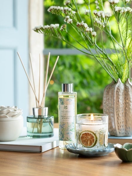 A selection of National Trust homeware, including candles, reed diffusers and vases