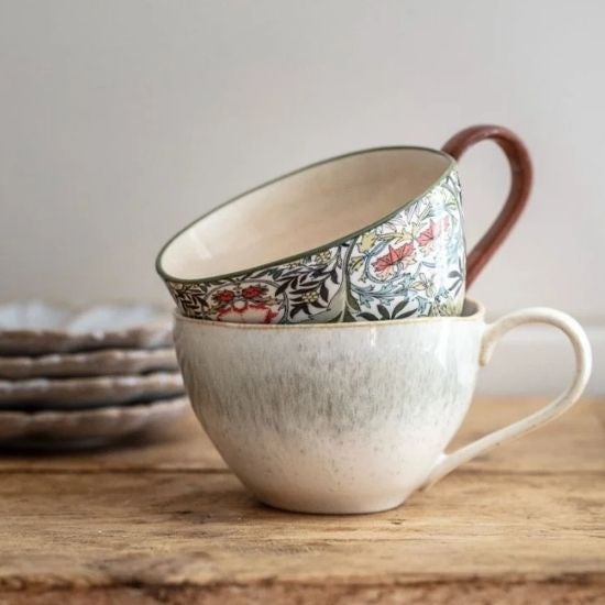National Trust heritage print mug resting on a speckled print mug