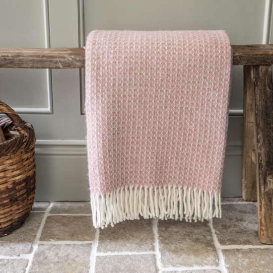 National Trust Dusky pink throw on a bench