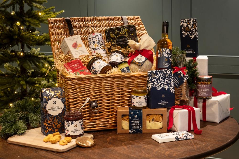 A National Trust luxury Christmas hamper with a selection of jams, biscuits, chocolate, crackers, chutneys and wine