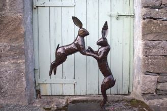 Image show National Trust recycled metal boxing hairs against a blue grey wooden door