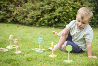 Children's games - image shows selection of toys and games from the National Trust children's range, including Squirrel Jump the board game, Jellycat soft toys Conker and Acorn, as well as the Match a Tree card game and Woodland Dominoes.