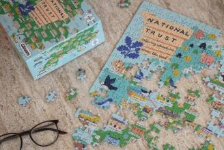 Children's games - image shows selection of toys and games from the National Trust children's range, including Squirrel Jump the board game, Jellycat soft toys Conker and Acorn, as well as the Match a Tree card game and Woodland Dominoes.