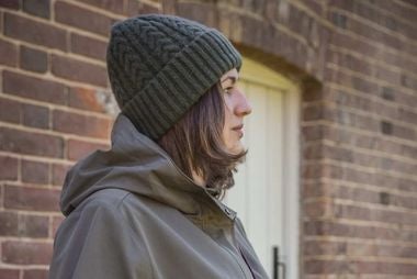 Hats - Woman wearing a National Trust  green knitted beanie hat 