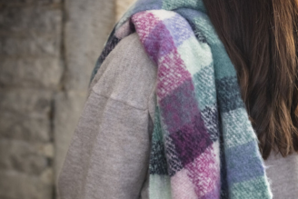 Scarves - image shows model wearing the Hinton Ampner inspired scarf from the new National Trust autumn winter range.