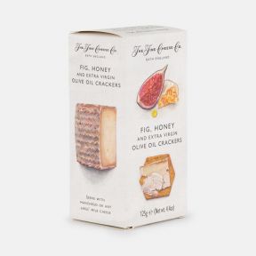 The Fine Cheese Co. Fig, Honey and Extra Virgin Olive Oil Crackers in a 125g carton, shown with a stack of hexagonal crackers and illustrated fig and cheese imagery on the packaging.