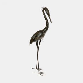 Metal garden sculpture of a tall heron shown from a side angle, with a long curved neck, slender legs, pointed beak and layered metal feathers, finished in a weathered bronze and brown tone, isolated on a white background