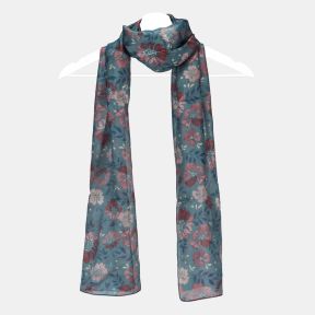 Blue floral scarf with an all-over pink and red floral print, lightweight semi-sheer fabric, and long rectangular design displayed draped on a hanger.