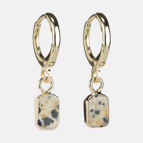 Gold-tone huggie hoop earrings with rectangular speckled stone drop charms featuring cream, grey and warm beige natural stone detailing.