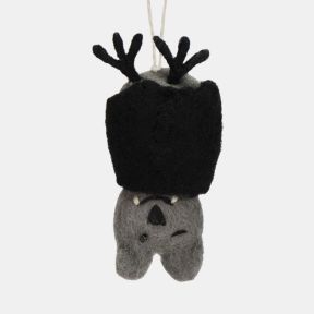 Felt bat hanging decoration with a grey felt body, black folded wings, and a playful winking expression. Finished with black felt ears, small white fangs, and a natural hanging loop, making it a charming Halloween ornament for seasonal displays, tree deco