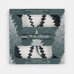 Frosted Pines fragranced ceramic tree decoration gift set featuring six white embossed Christmas tree ornaments with hanging ribbons and a 15ml festive room fragrance spray, presented in a green winter-themed gift box.