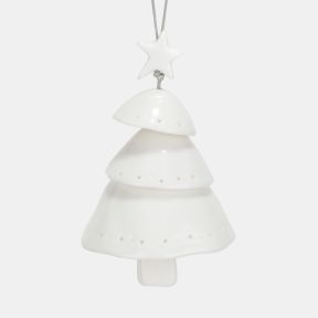 White ceramic Christmas tree hanging decoration shown in a close-up view, featuring a layered tiered tree design with a star topper, smooth glazed finish, subtle pierced dot detailing, and a silver hanging cord for festive seasonal décor.