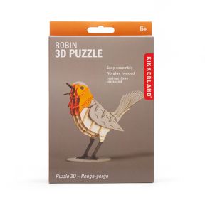 Front of Kikkerland Robin 3D Puzzle kit box featuring a completed robin bird model made from layered puzzle pieces. Packaging highlights easy assembly, no glue required, included instructions, and suitability for ages 6 and up.