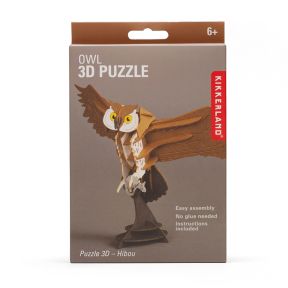 Front of Kikkerland Owl 3D Puzzle kit box featuring a completed owl model with outstretched wings. Packaging highlights easy assembly, no glue required, included instructions, and suitability for ages 6 and up.