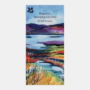 National Trust magnetic shopping list pad featuring a colourful landscape illustration of lakes, wetlands and rolling hills in shades of blue, purple, green and gold, with the text “Magnetic Shopping List Pad” and “50 lined pages” on the cover, displayed 