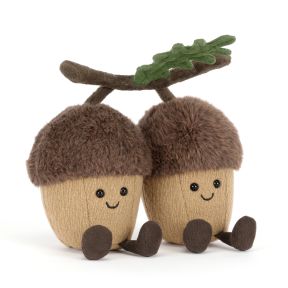Jellycat acorn soft toy featuring two smiling plush acorns joined by a soft branch with green oak leaves. The cuddly woodland duo has fluffy brown caps, tan bodies, corduroy legs and embroidered facial details.