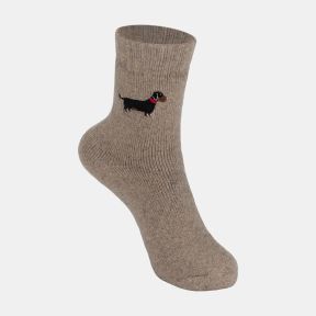 Light brown ankle sock with a soft marl texture and ribbed cuff, featuring an embroidered black and tan dachshund motif with a red collar on the outer ankle, displayed against a white background.