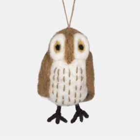 Handcrafted felt owl hanging decoration displayed against a light background. The ornament features a brown and cream owl with a rounded body, large cream facial markings and circular yellow eyes with black centres. The cream chest is decorated with stitc