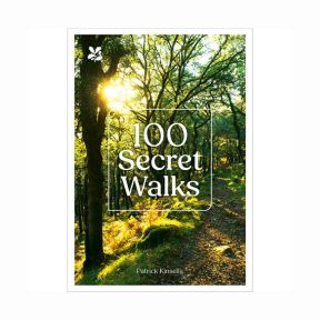 Front cover of the book “100 Secret Walks” by Patrick Kinsella, showing a sunlit woodland path lined with trees and autumn leaves, with the title overlaid in white text.