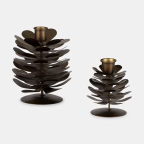 Set of two decorative metal candle holders designed to resemble pine cones. Featuring layered gold-toned metal petals and integrated candle cups, the holders are displayed in two different sizes against a plain light grey background.