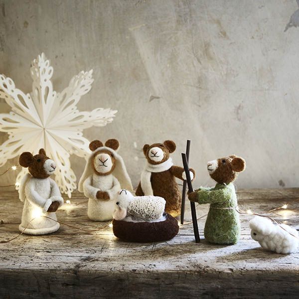 Wool mouse nativity set on a wooden surface with fairy lights and paper star decoration