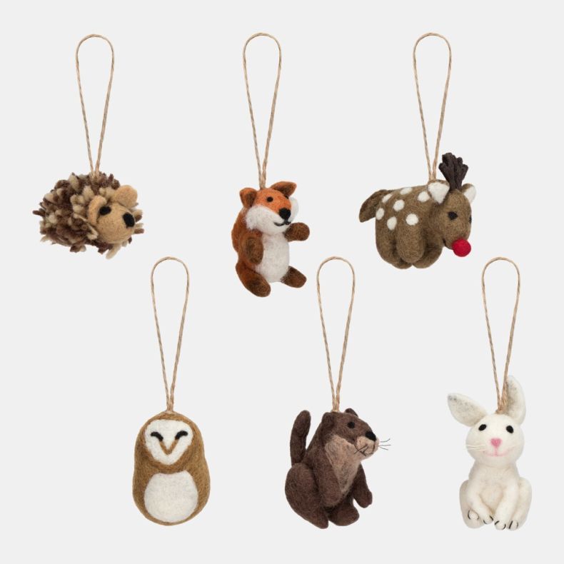 Felt woodland animal Christmas hanging decoration set featuring handcrafted felt ornaments including a hedgehog, fox, reindeer, owl, otter and white rabbit, each suspended from rustic twine loops with detailed needle-felted designs.
