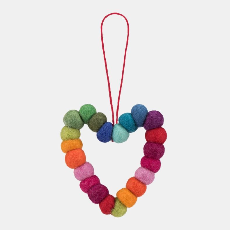 Handcrafted heart-shaped hanging decoration made from colourful felt wool balls arranged in a rainbow gradient, displayed against a light background. The decoration is formed from individually felted spheres in shades of green, yellow, orange, pink, red, 