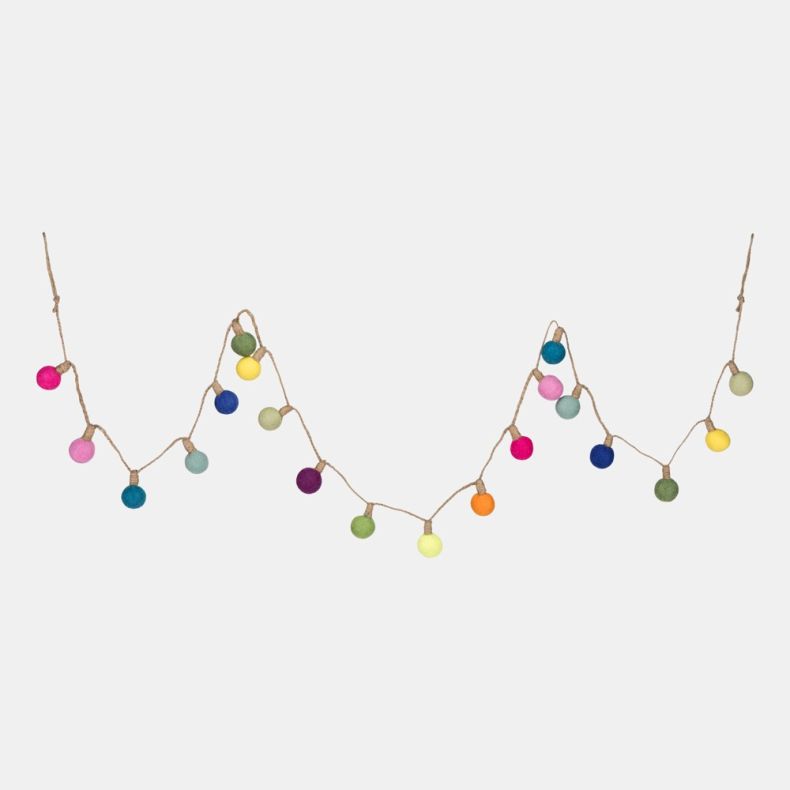 Colourful garland of felt pom-pom ball lights strung along natural twine, featuring bright shades of pink, blue, green, yellow, orange and purple, arranged in a decorative draped pattern against a plain light grey background.