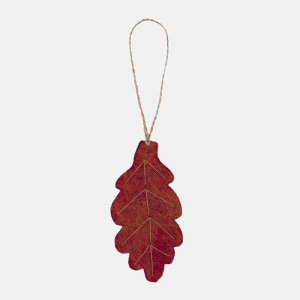Autumn leaf hanging decoration displayed against a light background, featuring a stylised oak leaf shape in rich shades of red and burnt orange with printed vein detailing. The decoration has a soft felt-like texture and is suspended from a natural twine 