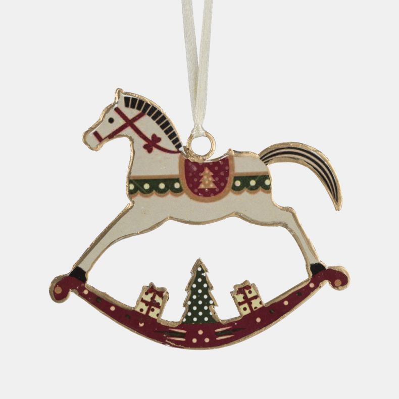 Wooden rocking horse Christmas hanging decoration shown in a close-up view, featuring a cream horse with red bridle and saddle details, green scalloped trim, a festive Christmas tree motif, gift illustrations on the curved rocking base, gold-tone edging, 