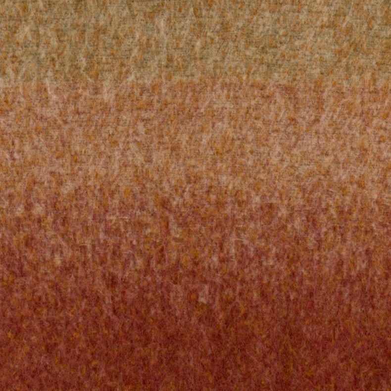 Orange, rust and burgundy ombre scarf fabric shown in a close-up view, highlighting the soft brushed texture and blended colour gradient in warm autumnal tones.