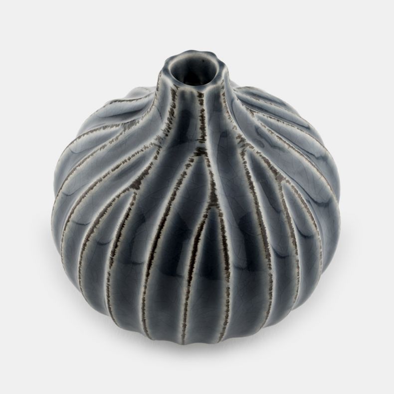 Decorative ceramic vase with a rounded, sculptural silhouette and short narrow neck, featuring deep vertical fluting that creates a ribbed, pumpkin-like form. The vase is finished in a glossy blue-grey glaze with darker shading in the recessed grooves and