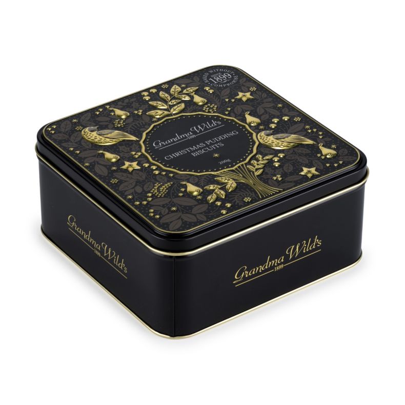 Grandma Wild's Christmas Pudding Biscuits gift tin featuring an ornate festive bird and foliage design in black and gold, presented in a square metal keepsake tin with decorative seasonal detailing.