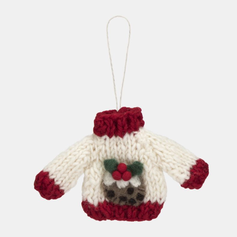 White knitted Christmas jumper hanging decoration with red ribbed collar, cuffs and hem, featuring a festive Christmas pudding motif with holly leaves and red berries, suspended from a white hanging loop.