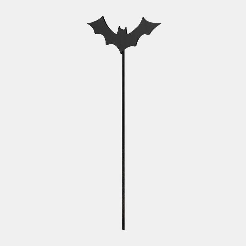 Metal garden stake featuring a black bat silhouette with outstretched wings, mounted on a slender metal rod for placement in flower beds, planters or garden displays, isolated on a white background.