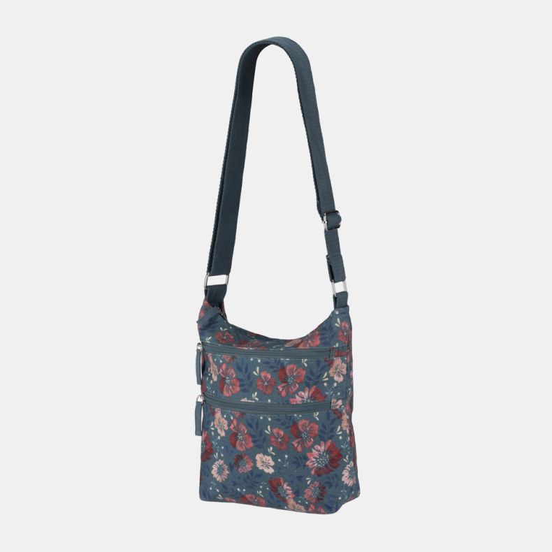 Blue floral crossbody bag with adjustable shoulder strap, dual front zip pockets, and silver-tone hardware shown from an angled front view.