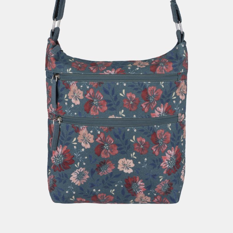 Blue floral crossbody bag with two front zip pockets, adjustable shoulder strap, and pink and red flower print detail.