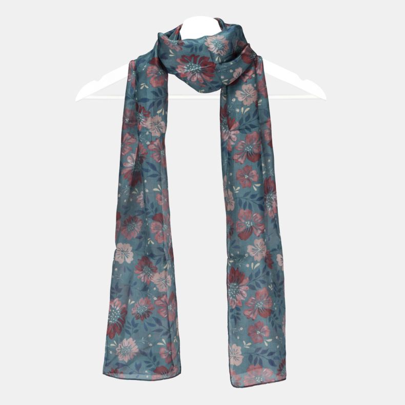 Blue floral scarf with an all-over pink and red floral print, lightweight semi-sheer fabric, and long rectangular design displayed draped on a hanger.