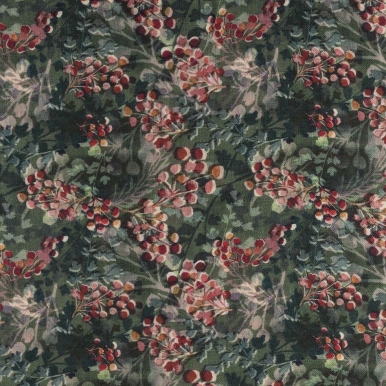 Green botanical print scarf featuring an all-over foliage and red berry pattern, shown in a close-up view highlighting the soft lightweight fabric and detailed nature-inspired design.