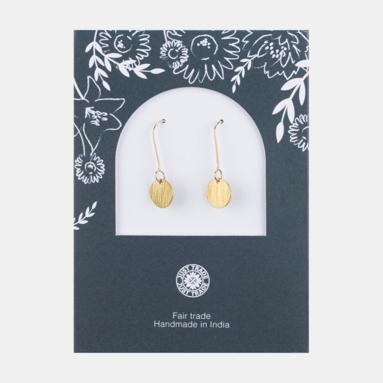Gold-tone disc drop earrings with a brushed textured finish and round pendant charms, displayed on a Just Trade jewellery card with elegant fishhook ear wires.