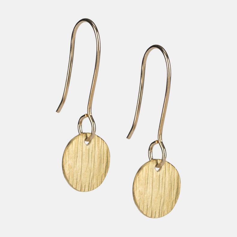 Gold-tone disc drop earrings shown from an angled view, featuring round textured pendants with a brushed finish and elegant fishhook ear wires.