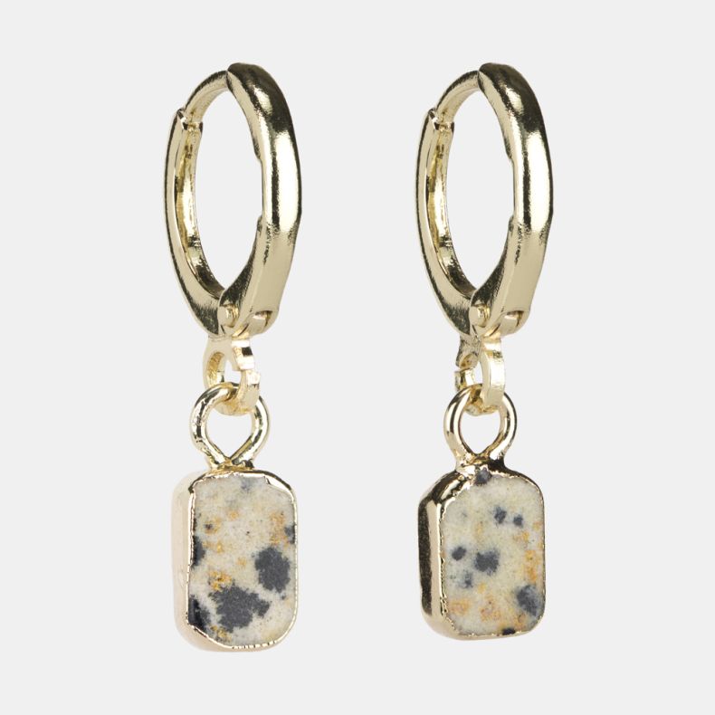 Gold-tone huggie hoop earrings with rectangular speckled stone drop charms featuring cream, grey and warm beige natural stone detailing.