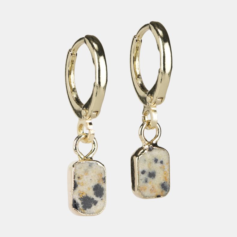 Gold-tone huggie hoop earrings with rectangular speckled stone drop charms in a cream-toned natural stone design with grey and warm beige fleck detailing.