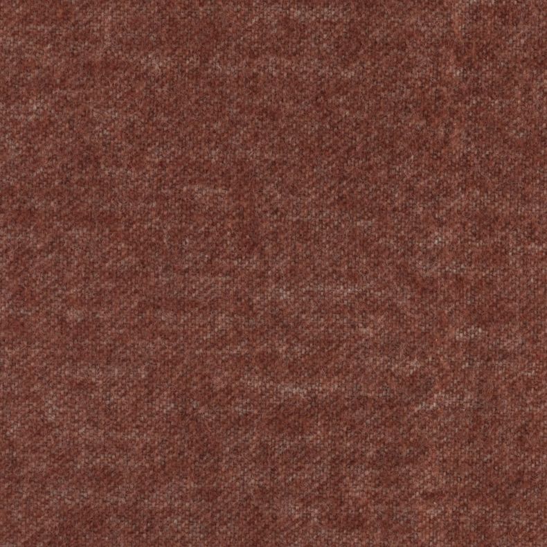 Close-up of a rust-orange throw blanket with a soft, brushed woven texture and subtle mottled finish. The cosy fabric showcases a warm, autumn-inspired tone, highlighting the blanket's inviting feel and finely detailed weave.