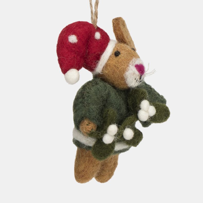 Felt mouse Christmas hanging decoration shown in a close-up side view, featuring a brown wool-effect body, red spotted Santa hat, dark green jumper, pink nose, white whisker detailing, and a sprig of mistletoe with white berries, finished with a rustic tw