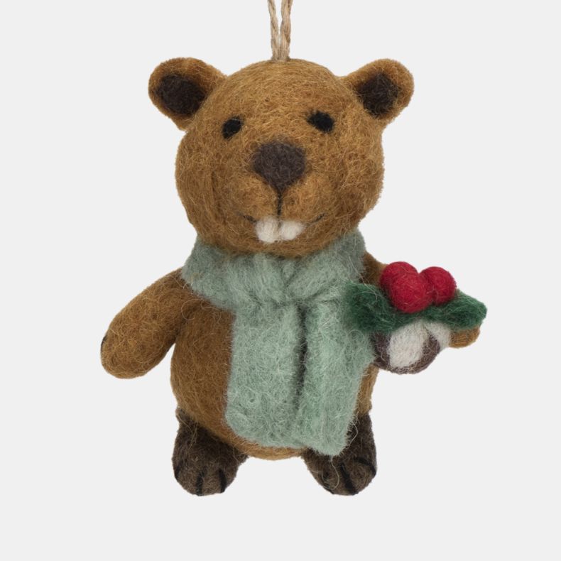 Felt beaver Christmas hanging decoration shown in a close-up front view, featuring a brown wool-effect body, pale blue scarf, and a holly sprig with red berries, finished with handcrafted needle-felted detailing, embroidered facial features, prominent buc