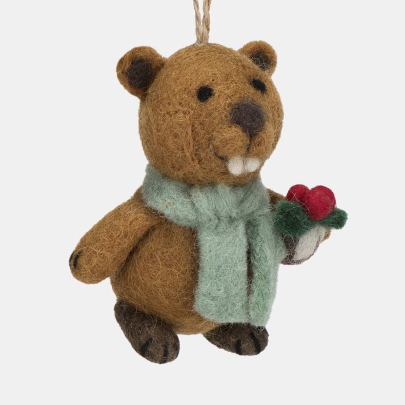 Felt beaver Christmas hanging decoration shown in a close-up angled side view, featuring a brown wool-effect body, pale blue scarf, and a holly sprig with red berries, finished with handcrafted needle-felted detailing, embroidered facial features, promine