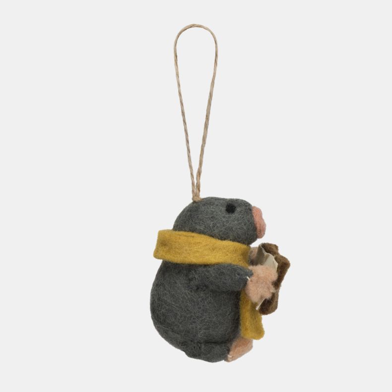 Felt mole Christmas hanging decoration shown from a side view, featuring a dark grey wool-effect body, mustard yellow scarf, pink nose and paws, and a brown carol songbook with musical note detail, finished with handcrafted needle-felted detailing and a r