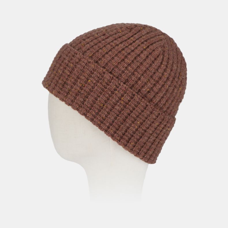 Rust orange flecked knit beanie hat with a textured ribbed design, soft wool-look finish, and subtle multicoloured speckled yarn detail, shown from an angled side view for cosy cold-weather wear.