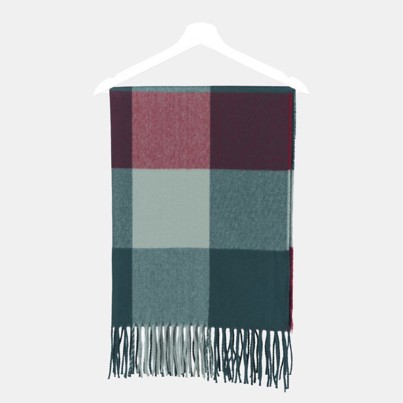 Teal and burgundy check scarf with oversized colour block squares in teal, aqua and burgundy tones, featuring a soft brushed texture and fringed ends, displayed folded on a hanger.